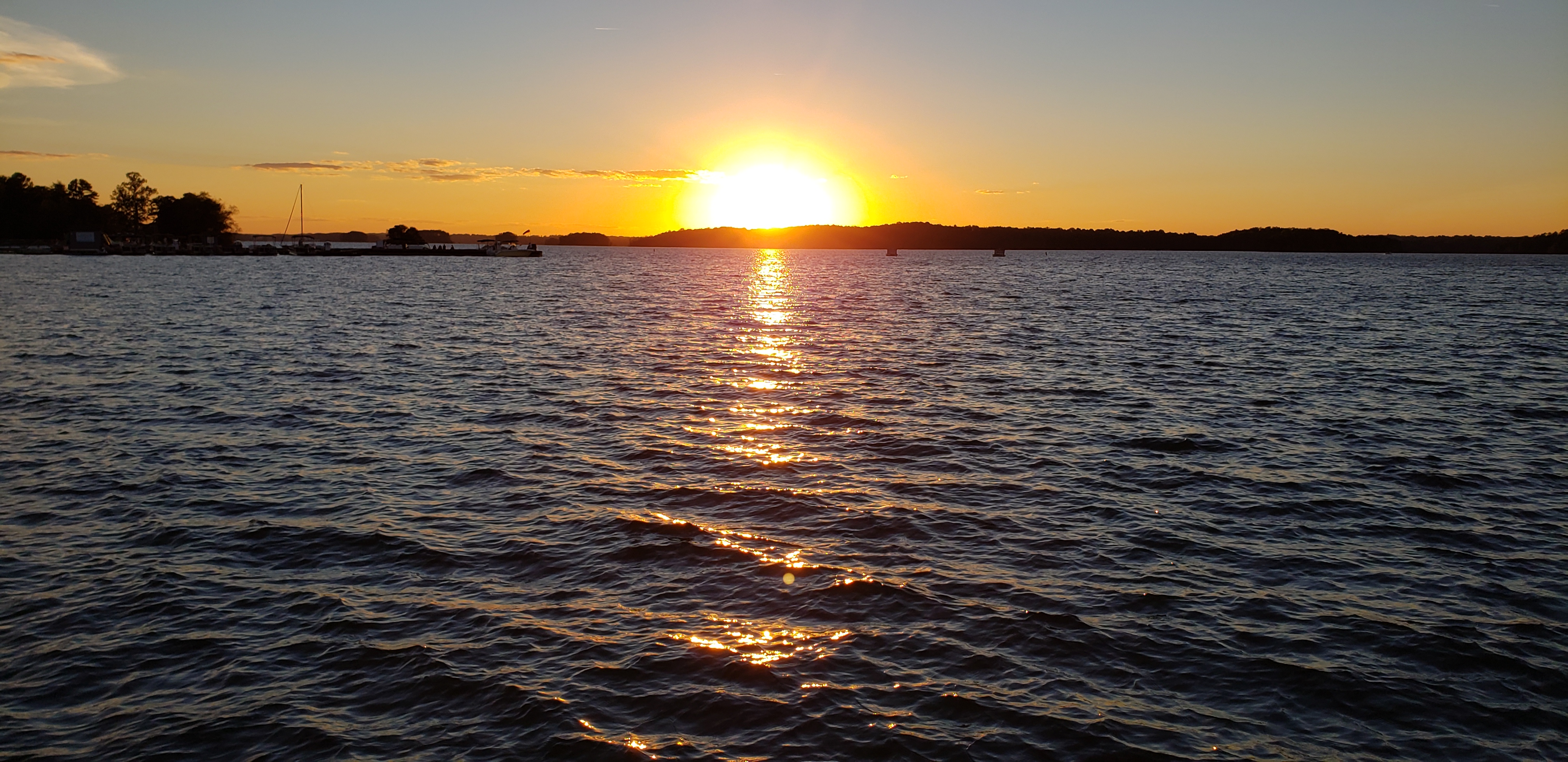 Header background showing sunset on lake lanier